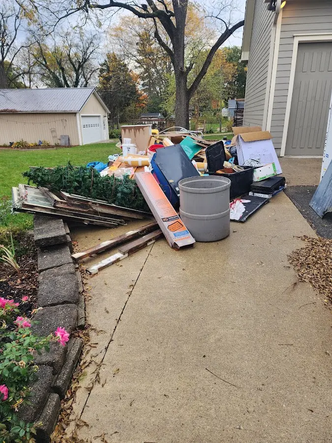 Dumpster being loaded with debris for 30 Yard Dumpster Rental in Gardiner